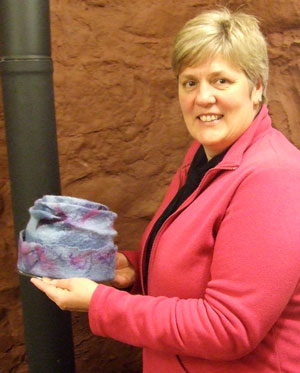 Elaine with one of her hand felted hats